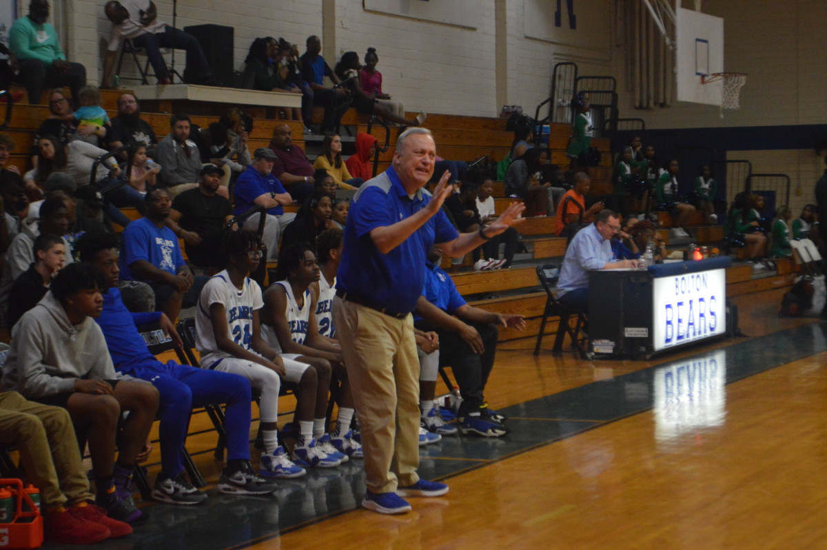 Bolton coach Fred Eloi instructs his Bears from the bench. 